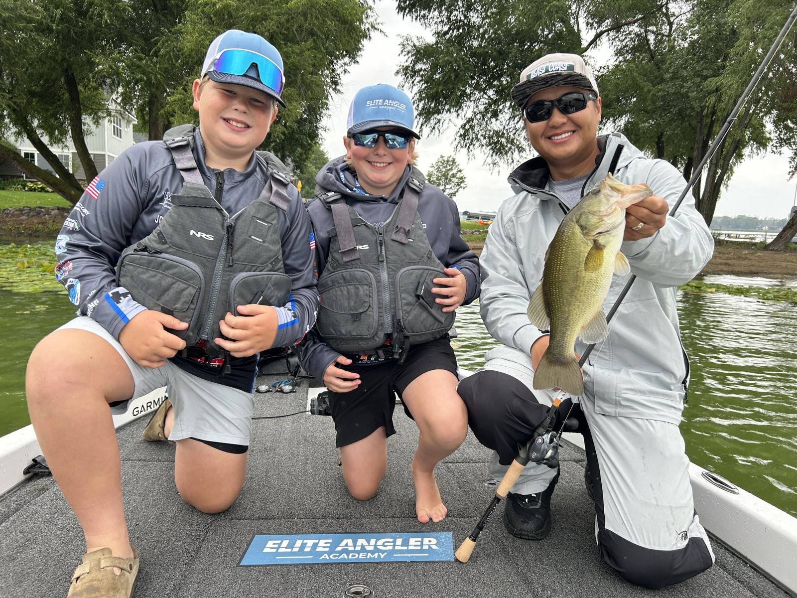 Trevor Lo with student anglers on the water
