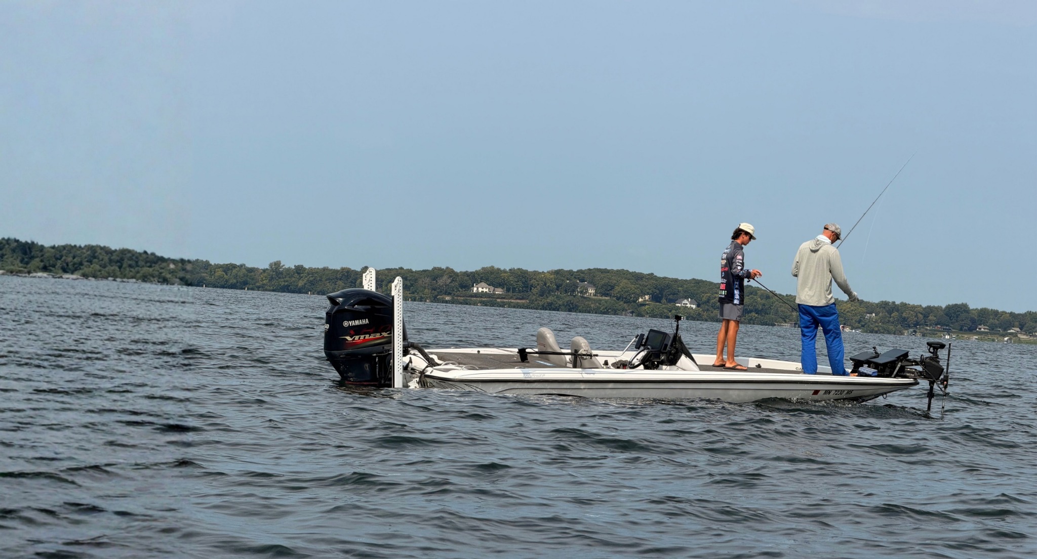 Matt coaching a student angler on the water